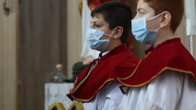 Altar boys take part in a mass at the Mart Shmoni church in Erbil, the capital of the autonomous Kurdish region of northern Iraq. AFP
