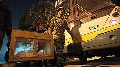 Soldiers collect ballots at the end of voting for the run-off of the first round of voting in Cairo.