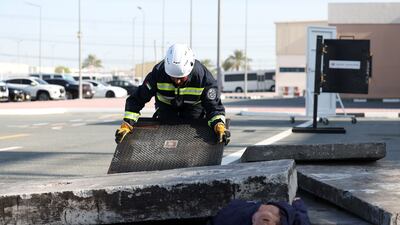 A member practices from the best way to help a person trapped under rubble.