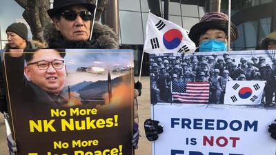 Members of conservative groups shout slogans during a rally against North Korea's nuclear power in downtown in Seoul, South Korea, on January 9, 2018. Jeon Heon-kyun / EPA