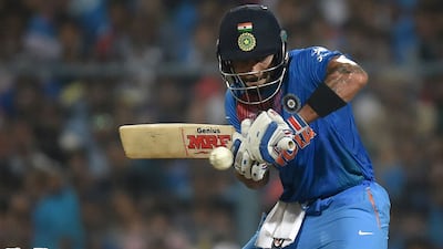 India's Virat Kohli plays a shot at the last moment after having judged for pace and turn from Pakistan's Shahid Afridi at the Eden Gardens, Kolkata. Prakash Singh / AFP