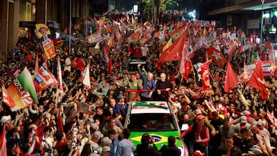 Brazil's President Luiz Inacio Lula da Silva greets supporters during a campaign rally in Porto Alegre before the presidential runoff election. AFP