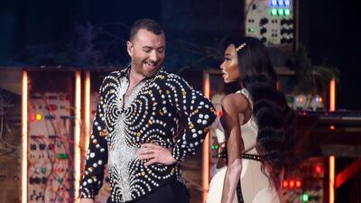 Sam Smith performs with model Winnie Harlow. Joel C Ryan/Invision/AP