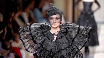 Net has been cut and beaded to create an oversized collar at Giorgio Armani. Photo by Charles Platiau / Reuters