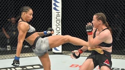 Taila Santos of Brazil kicks Molly McCann of England in their flyweight fight during the UFC Fight Night event inside Flash Forum on UFC Fight Island in Yas Island, Abu Dhabi. Photo by Jeff Bottari / Zuffa LLC via Getty Images