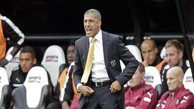 Norwich City manager Chris Hughton watches his side from the touchline.