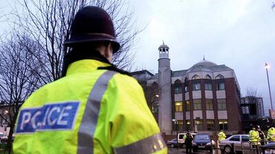A police officer stands in front of Finsbury Park Mosque, where an attack on pedestrian Muslim took place. Nicolas Asfouri / EPA