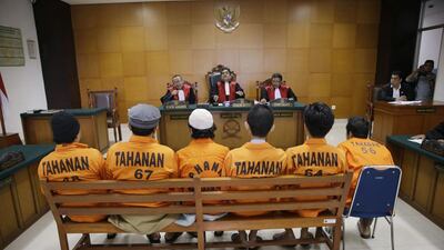 Suspected militants attend a sentencing hearing in Jakarta, Indonesia on June 7. The country’s military chief said there are ISIL cells across all of Indonesia. Achmad Ibrahim / AP Photo