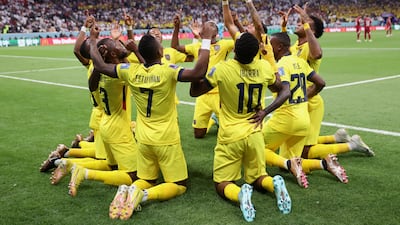 Ecuador's Enner Valencia celebrates with teammates after scoring the opening goal from the penalty spot in the 2-0 win against Qatar at Al Bayt Stadium on November 20, 2022. Getty