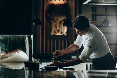 The open kitchen where Kyo's chefs prepare dishes is designed to give diners a unique culinary experience