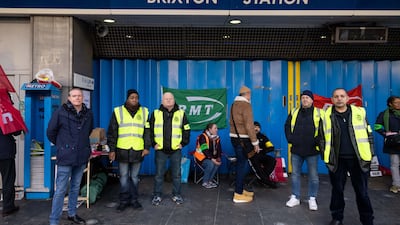 London Underground workers strike outside Brixton station in London. Bloomberg