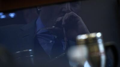 Depp is reflected in a courtroom monitor while listening to an audio recording. AFP