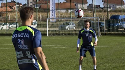 Kosovo manager Albert Bunjaku conducts a training session ahead of their World Cup qualifying matches. Visar Kryeziu / AP