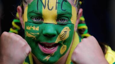 A Norwich City fan shows her colours during a match between Norwich City and Everton at Carrow Road. Jamie McDonald / Getty Images