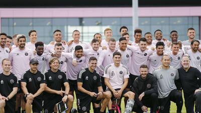 Head coach Diego Alonso, owner and president of soccer operations David Beckham, and owner Jorge Mas of Inter Miami pose for a photo with the team. AFP