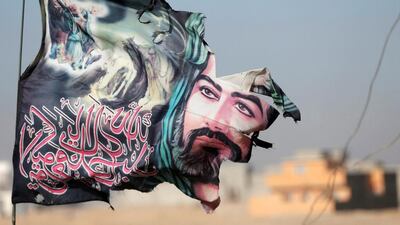 A flag of Imam Hussein is seen on an Iraqi special forces soldiers in Mosul, Iraq.