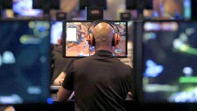A visitor plays the World of Warcraft: Warlords of Draenor at the Blizzard Entertainment exhibition stand. Ina Fassbender / Reuters