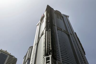 The charred black line along Dubai Marina's Torch tower, one of the world's tallest residential buildings, after Friday morning's fire. Reem Mohammed / The National.