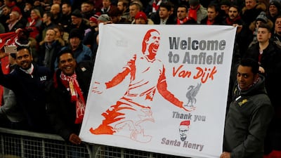 Liverpool fans with a banner welcoming Virgil van Dijk to the club. The Dutchman is in line to make his debut against Everton in the FA Cup third round at Anfield. Phil Noble / Reuters