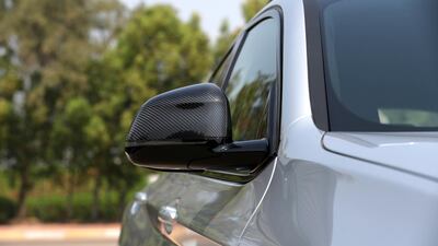 A carbon-fibre finish on the wing mirrors lends an extra dose of gravitas. Chris Whiteoak / The National