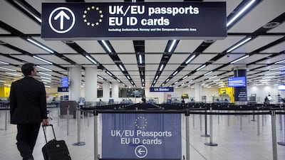 The UK’s Border Force officers check the passports of passengers arriving at Gatwick Airport, London, before freedom of movement with the EU ended. Getty
