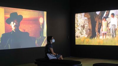 A guest on the opening night of the exhibition. AFP