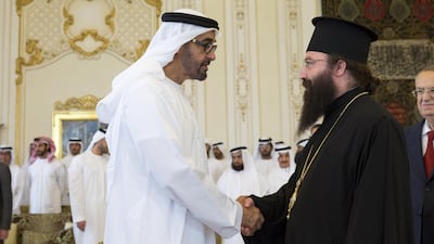 Sheikh Mohammed talks to a member from the delegation of the Greek Orthodox Patriarch of Antioch and all the East.