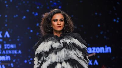 Ashish N Soni, and Gauri & Nainika Karan blend monochrome with on-trend tiered ruffles. Chandan Khanna / AFP