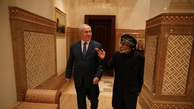 Sultan Qaboos walks with Mr. Netanyahu in Muscat. Reuters