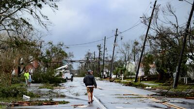 A local walks down the street after Hurricane Michael made landfall in Panama City, Florida. AFP
