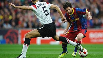 Lionel Messi dribbles the ball past Manchester United’s Rio Ferdinand as Barcelona beat their English opponents in the Champions League final, 3-1.