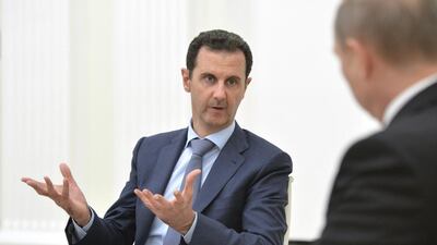 Mr Al Assad speaking with Mr Putin a. Alexei Druzhinin / RIA Novosti Kremlin/Reuters
