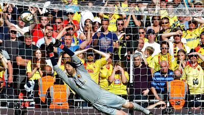 Manuel Almunia, the former Arsenal goalkeeper who has done a fabulous job for Watford all season, could not stop Phillips' decisive strike. Toby Melville / Reuters