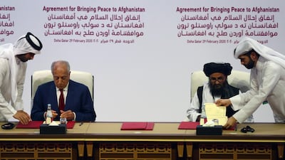 Mullah Abdul Ghani Baradar, the leader of the Taliban delegation, signs an agreement with Zalmay Khalilzad, US envoy for peace in Afghanistan, at a signing agreement ceremony between members of Afghanistan's Taliban and the US in Doha, Qatar February 29, 2020. Reuters