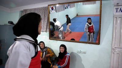 Under the Taliban, women were not allowed to go to school, work outside the home or leave their house without a male escort. AP