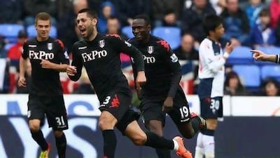 Clint Dempsey, second left, wheels away in celebration after scoring the first of his two goals in a rare 3-0 away win for Fulham at Bolton Wanderers yesterday. Clive Brunskill / Getty Images