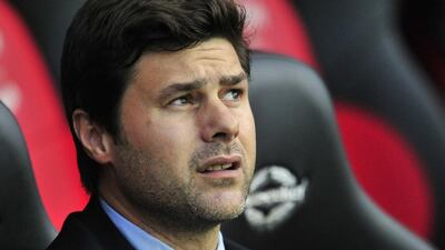 Southampton’s Argentinian manager Mauricio Pochettino awaits kick-off of the English Premier League football match between Southampton and Fulham at St Mary’s Stadium in Southampton, southern England on October 26, 2013. AFP PHOTO/GLYN KIRK