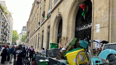 Student stage a sit-in at the entrance to Sciences Po university. AP