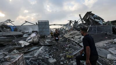 Palestinians search for bodies and survivors among the rubble of a building following an Israeli attack on Zawayda neighbourhood, in central Gaza Strip, on August 17, 2024. EPA