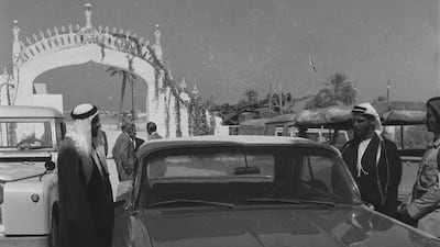 Archival photograph of the Trucial States shot by photographer Guy Gravett. This images shows Sheikh Zayed and Sultan at entance to a palace in 1962