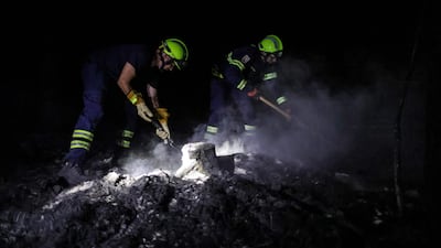 Austrian firefighters help to extinguish a fire in a forest of South Gironde, near Belin-Beliet, in south-western France. AFP
