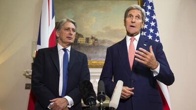 Following a meeting with British foreign secretary Philip Hammond, left, US secretary of state John Kerry said a timeline for Bashar Al Assad’s departure doesn’t have to be determined immediately. Evan Vucci/AP Photo