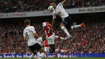 Arsenal's Danny Welbeck, right, Tottenham Hotspur's Jan Vertonghen, left, and Younes Kaboul, top, compete for the ball on Saturday during their Premier League match. Suzanne Plunkett / Reuters