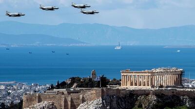 Greek Air Force F4 aircraft fly over the Parthenon in Athens. AFP