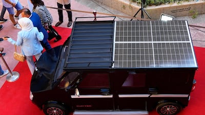 The car is powered by fast-charge battery and solar panels and can travel about 150 miles. AP Photo