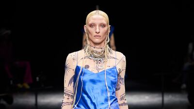 A tracksuit is rethought into a floor-length Jean Paul Gaultier strapless dress.