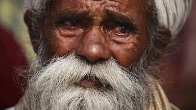 Father of Indian civilian Sawarn Singh who was killed in Pakistani shelling mourns outside a hospital in Ramgarh sector, Samba district of Jammu and Kashmir. Channi Anand / AP Photo