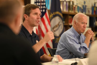 US President Joe Biden listens to Kentucky Governor Andy Beshear on the continuing response to the recent flooding at Marie Roberts Elementary School, in Lost Creek, Kentucky on August 8. AFP