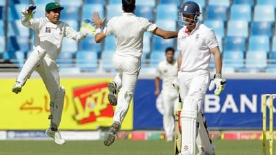 Adnan Akmal claimed seven catches in Pakistan's victory over England in Dubai.