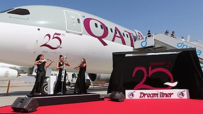 Musicians perform next to the 25th aircraft of the Boeing 787 Dreamliner received by Qatar Airways. Marwan Naamani / AFP